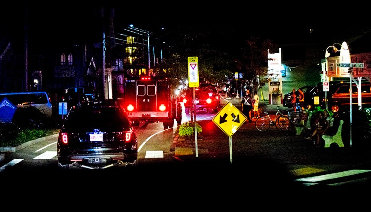 President Barack Obama's motorcade leaves Lola's, a Southern seafood restaurant in Oak Bluffs, Mass., on Martha's Vineyard, and cruises to the usually crowded downtown street early Monday after a first family late night social event with friends. Manuel Balce/Associated Press