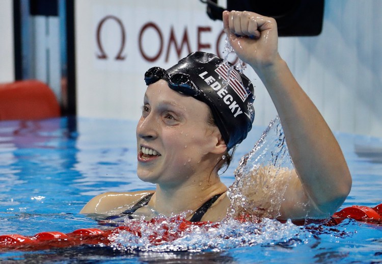 Katie Ledecky celebrates after winning gold Friday night in the women's 800-meter freestyle and breaking her own world record in the event.
Associated Press/Julio Cortez