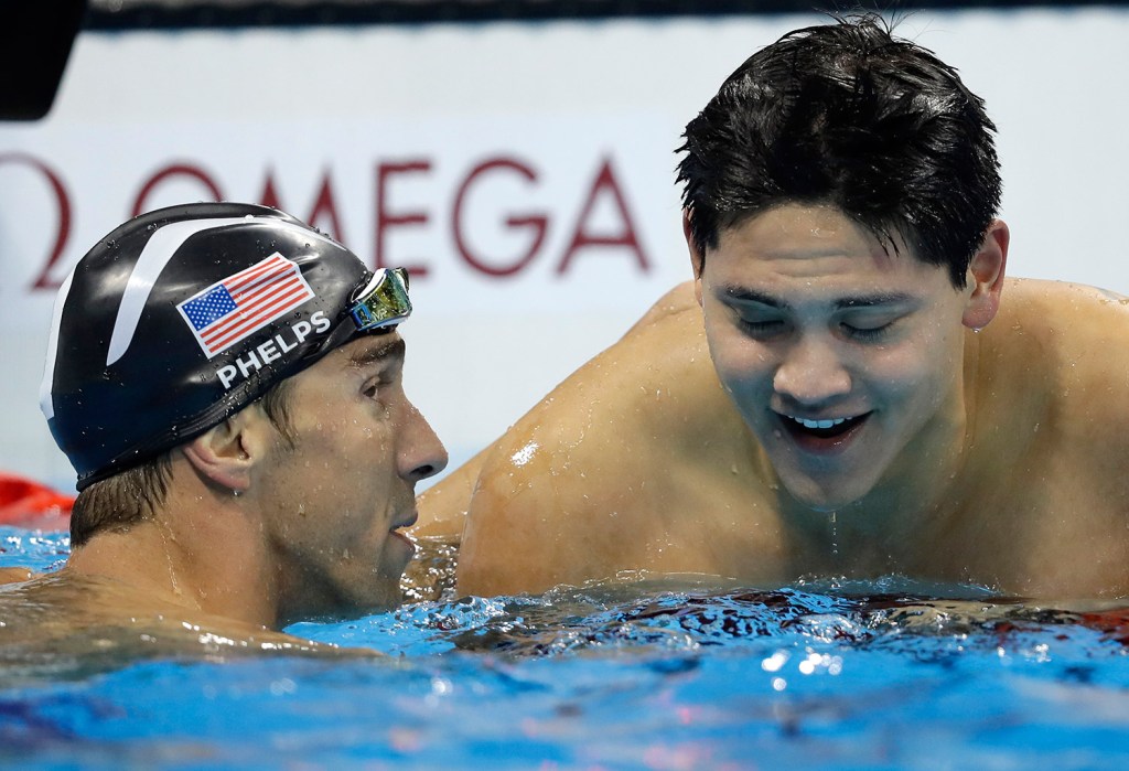 Singapore's Joseph Schooling, right, is congratulated by Michael Phelps after winning the gold medal in the men's 100-meter butterfly Friday night in Rio de Janeiro
Associated Press/Michael Sohn