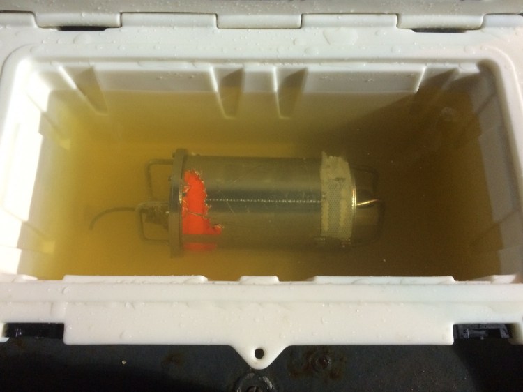 El Faro's voyage data recorder sits in fresh water aboard the USNS Apache tug. It was recovered Monday.