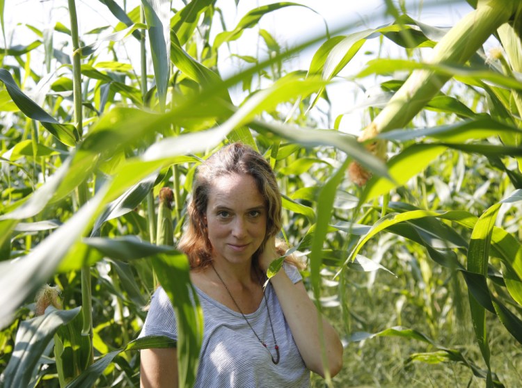 Author Caitlin Shetterly at a corn field in Freeport.  Derek Davis/Staff Photographer