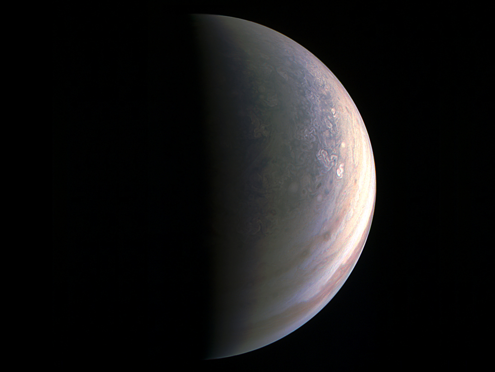 Image provided by NASA shows Jupiter's north polar region as photographed by the Juno spacecraft.