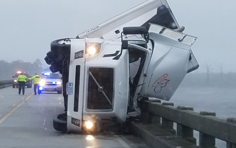 Authorities say high winds from Hermine tipped over an 18-wheeler in Columbia, N.C., on Saturday, killing its driver and shutting down the U.S. 64 bridge.