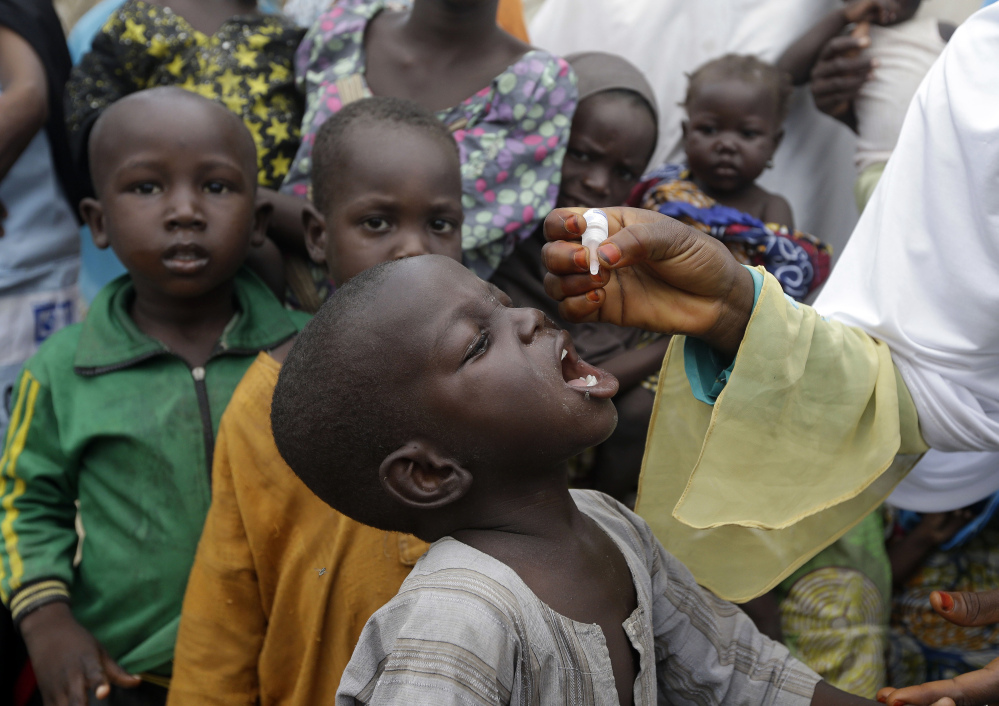Polio vaccine is administered at a camp for people displaced by Islamist extremists in Maiduguri, Nigeria. A campaign aims to vaccinate 25 million children this year.