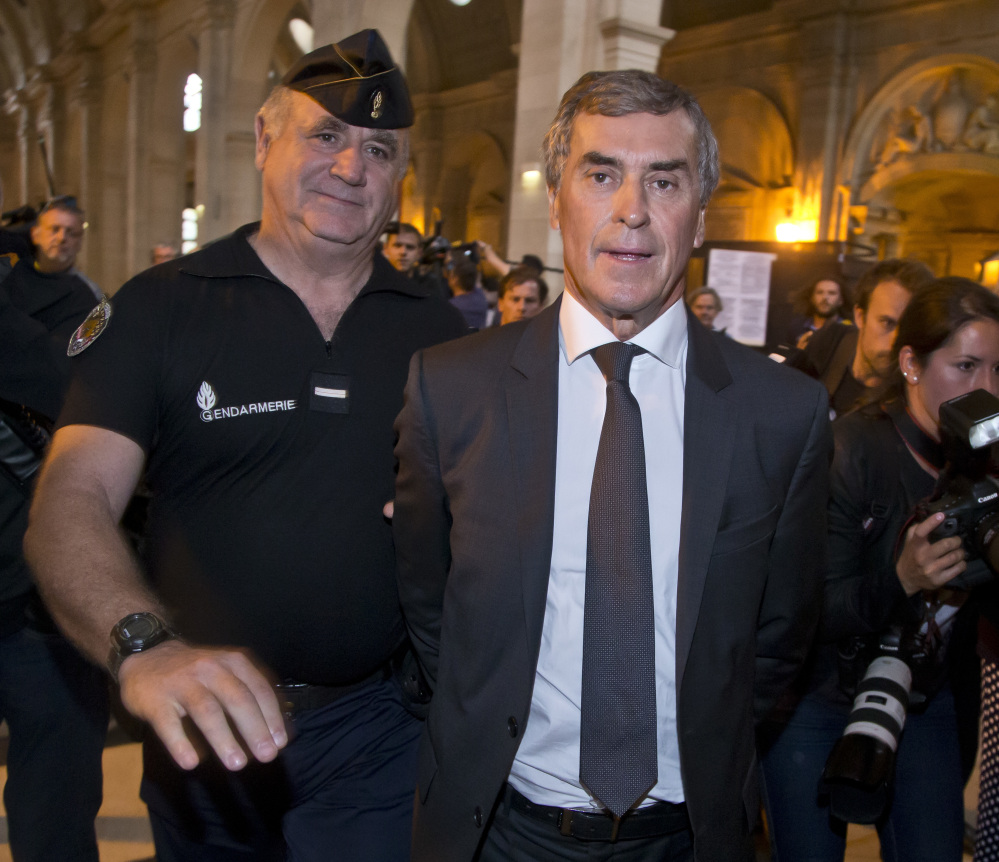 Former French Budget Minister Jerome Cahuzac leaves court Monday, charged with hiding part of his wealth in tax havens around the world while fighting tax evasion at home.