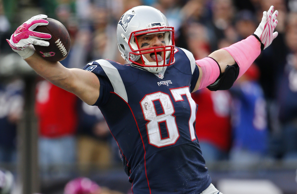 New England Patriots tight end Rob Gronkowski celebrates a touchdown against the New York Jets during a NFL football game at Gillette Stadium in Foxborough, Mass. Sunday, Oct. 25, 2015. (Winslow Townson/AP Images for Panini)