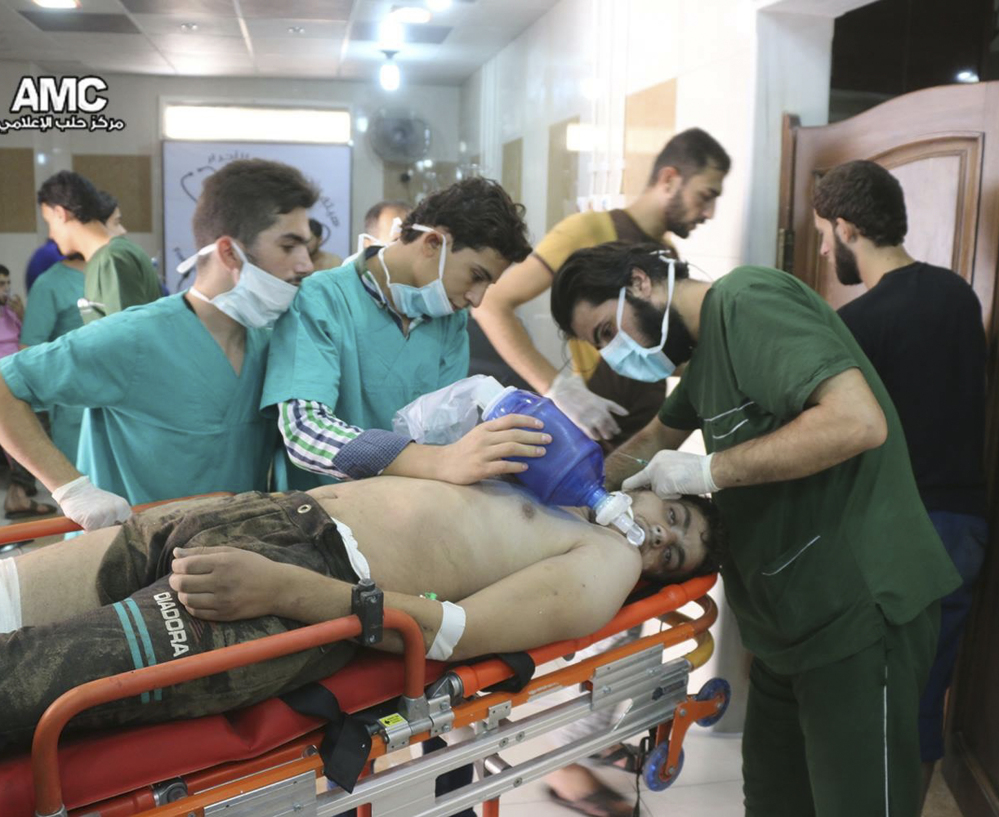 A man is treated for breathing difficulties in a hospital in Aleppo after a suspected chlorine gas attack Tuesday. The same area of Aleppo was hit by an airstrike Wednesday.