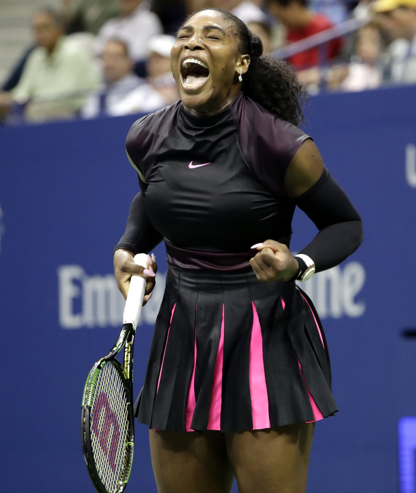 Serena Williams celebrates Wednesday night after winning a game against Simona Halep during the U.S. Open quarterfinals in New York. Williams, seeking a record 23rd major championship, will take on 10th-seeded Karolina Pliskova next.