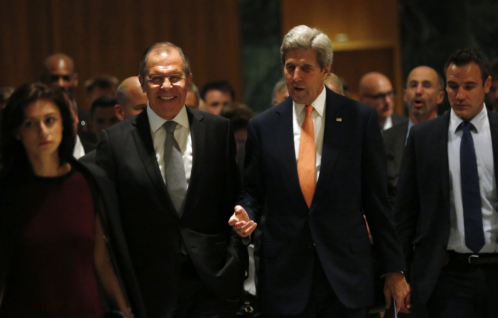 U.S. Secretary of State John Kerry, right, and Russian Foreign Minister Sergey Lavrov, walk in to their meeting room in Geneva, Switzerland, Friday to discuss the crisis in Syria.