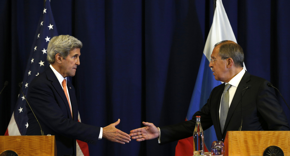 U.S. Secretary of State John Kerry, left, and Russian Foreign Minister Sergei Lavrov are about to shake hands at the conclusion of a joint news conference after their meeting to discuss the crisis in Syria, in Geneva, Switzerland.