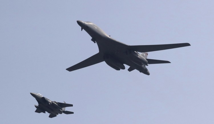 U.S. B-1 bomber, center,  flies over Osan Air Base with South Korean Air Forces jet in Pyeongtaek, South Korea, Tuesday. The United States has flown nuclear-capable supersonic bombers over ally South Korea in a show of force meant to cow North Korea after its fifth nuclear test and also to settle rattled nerves in the South.