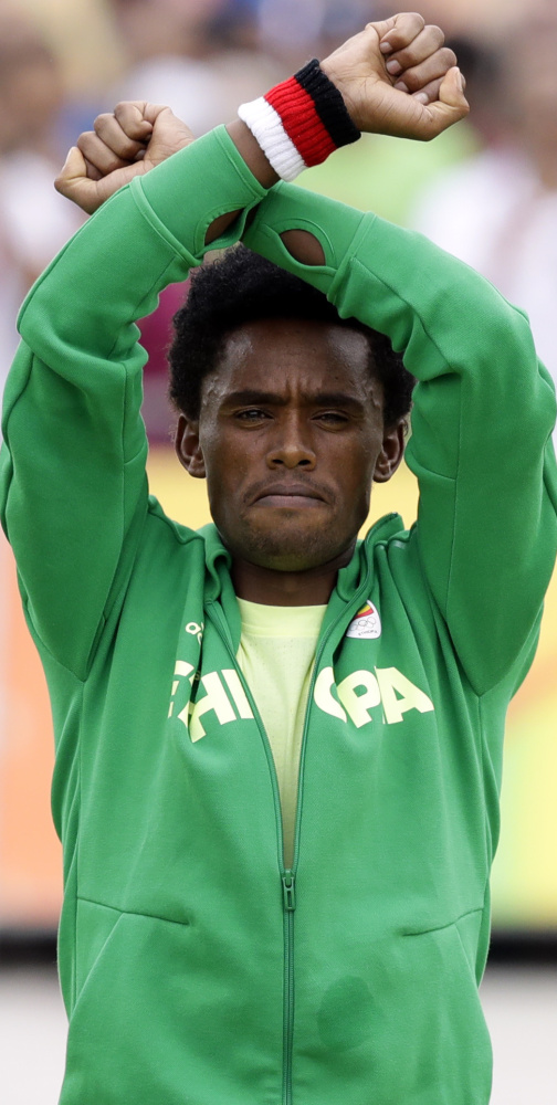 Feyisa Lilesa's efforts to bring international attention to deadly protests in Ethiopia have picked up support, but he is currently living in the U.S. on a special-skills visa because he's afraid to return home.