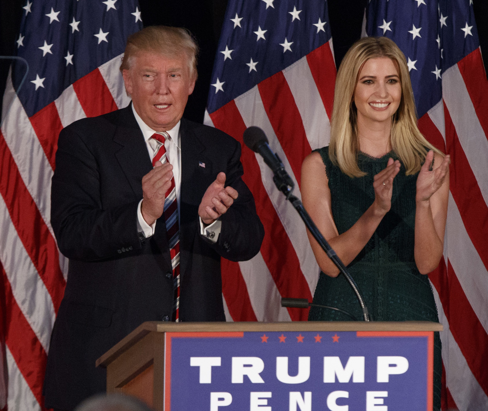 Ivanka Trump applauds as her father, Republican presidential candidate Donald Trump, delivers a policy speech on child care Tuesday in Aston, Pa.