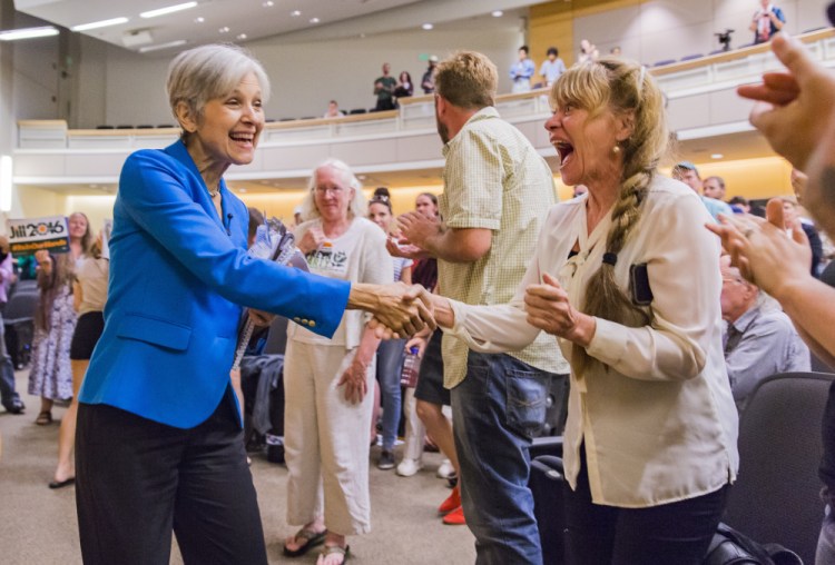 Green Party presidential nominee Jill Stein, left, greets Debra Walton at USM Wednesday night, where she told about 200 people she would tax Wall Street to pay off student loan debt.
