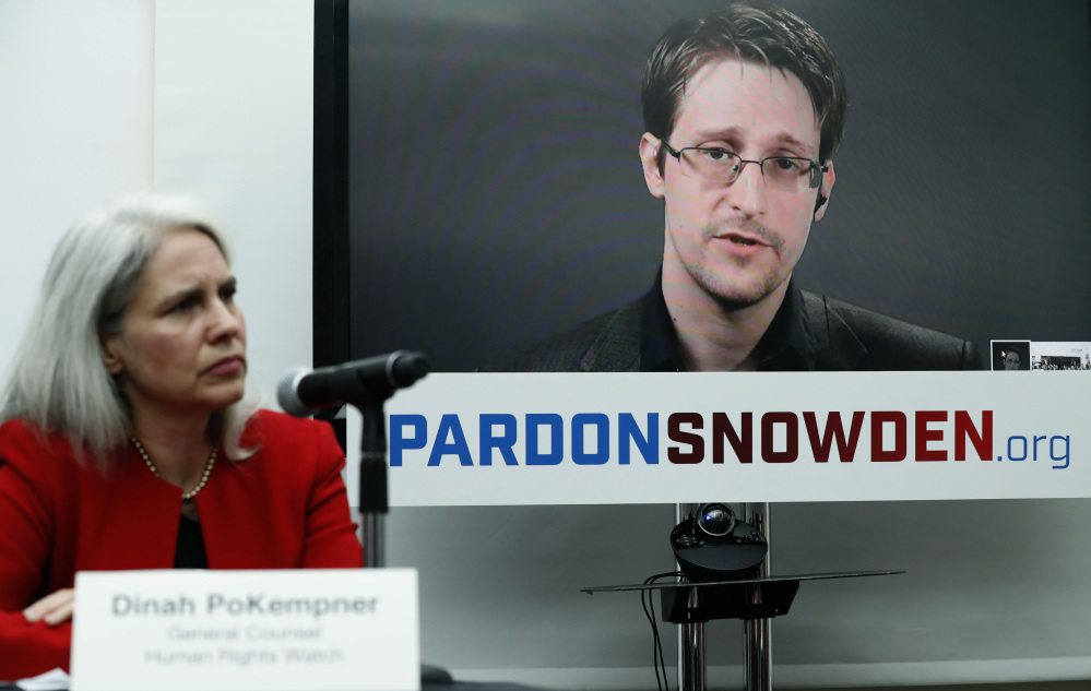 Dinah PoKempner of Human Rights Watch listens as Edward Snowden speaks via video link from Moscow on Wednesday.