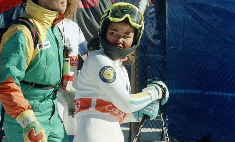 Seba Johnson checks her time after a run in the 1988 Winter Olympics in Calgary. Johnson was just 14, the youngest skier and the first black female Alpine skier to compete in the Olympics. 