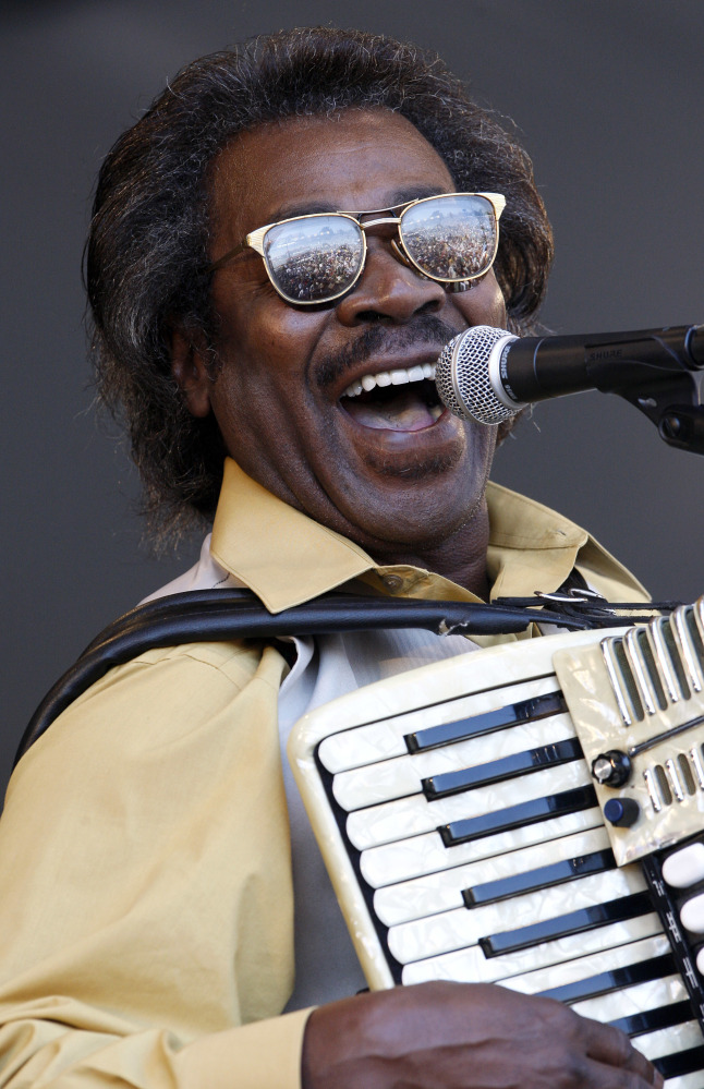 FILE - In this May 6, 2011 file photo, Buckwheat Zydeco performs at the'New Orleans Jazz and Heritage Festival in New Orleans.  Stanley "Buckwheat" Dural Jr., who introduced zydeco music to the world through his namesake band Buckwheat Zydeco, has died. He was 68. His longtime manager Ted Fox told The Associated Press that Dural died early Saturday, Sept. 24, 2016. He had suffered from lung cancer.(AP Photo/Patrick Semansky)