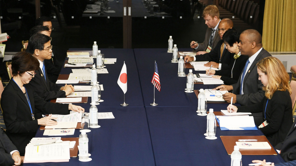 U.S. Transportation Secretary Anthony Foxx, second right, talks Friday with Japan's Land, Infrastructure, Transport and Tourism Minister Keiichi Ishii, second left, during their meeting held on the sidelines of G7 Transport Ministers' meeting in Karuizawa, Nagano Prefecture, north of Tokyo. Foxx says his counterpart ministers from the Group of Seven nations welcomed the new U.S. guidelines on regulating self-driving cars at a weekend meeting in Japan, and they agreed to work together to maintain safety.