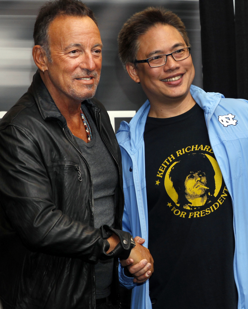 Bruce Springsteen greets a fan Tuesday at his book launch in Freehold. N.J.
