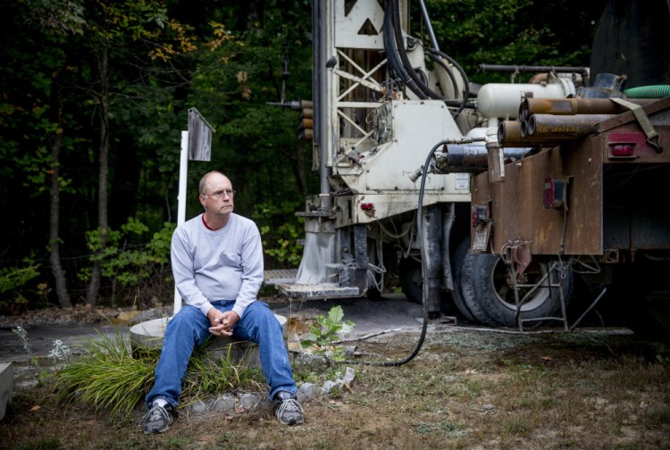 With a new well being drilled on his property in Standish, Bob Boynton sits atop the concrete casing of his shallow dug well, which ran dry a week ago as southern Maine and much of New England endure the region's worst drought in more than a decade. "It really caught me off guard," Boynton said.