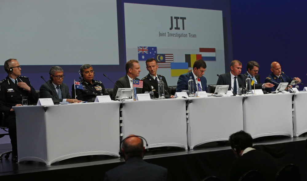 The Joint Investigation Team (JIT) prepare to speak on the preliminary results of the investigation into the shooting-down of Malaysia Airlines jetliner flight MH17 during a press conference in Nieuwegein, Netherlands, Wednesday, Sept. 28, 2016. The disaster claimed 298 lives.