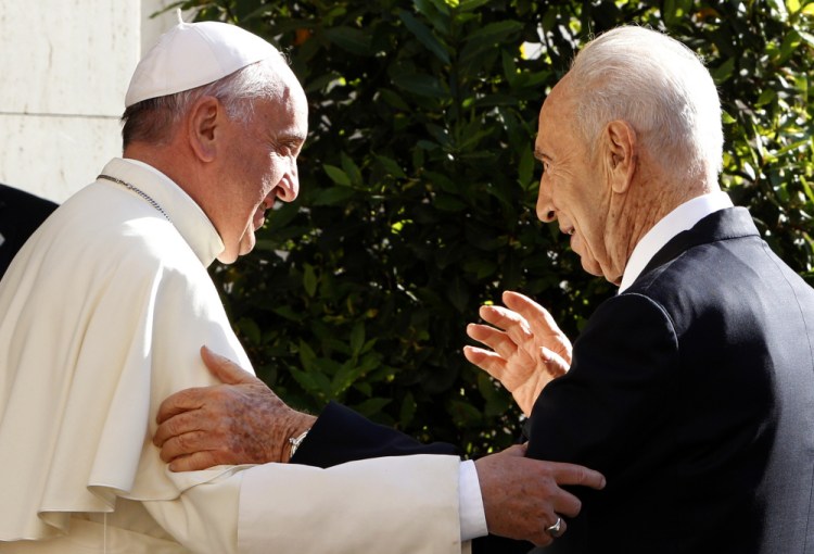 Pope Francis welcomes Israeli President Shimon Peres, right, upon his arrival at the Vatican in 2014. Israel's Foreign Ministry says a long list of world leaders will attend Shimon Peres' funeral on Friday. Spokesman Emmanuel Nahshon said Wednesday that President Obama, Bill and Hillary Clinton, Pope Francis, Prince Charles and Canadian Prime Minister Justin Trudeau are all expected.