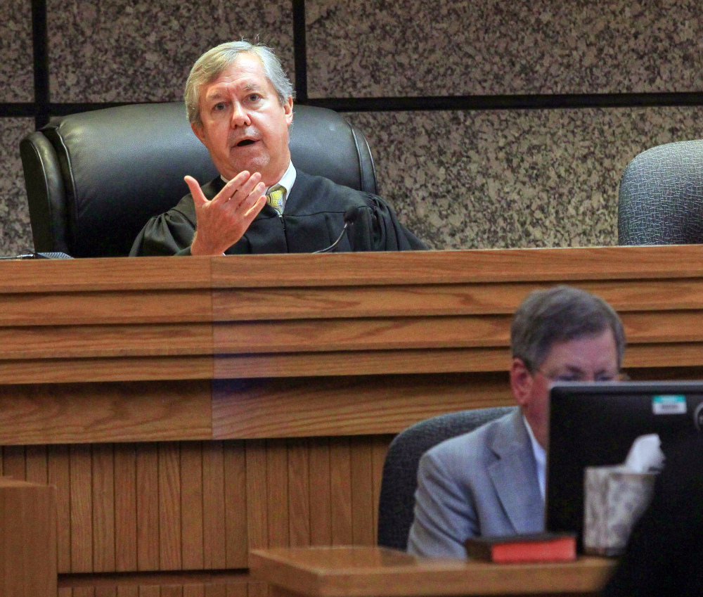 Judge Edgar Long presides over a hearing of a 14-year-old boy who was charged as a juvenile Friday in Anderson, S.C., with murder and three counts of attempted murder after authorities say he killed his father and opened fire on students at a playground, wounding three people.