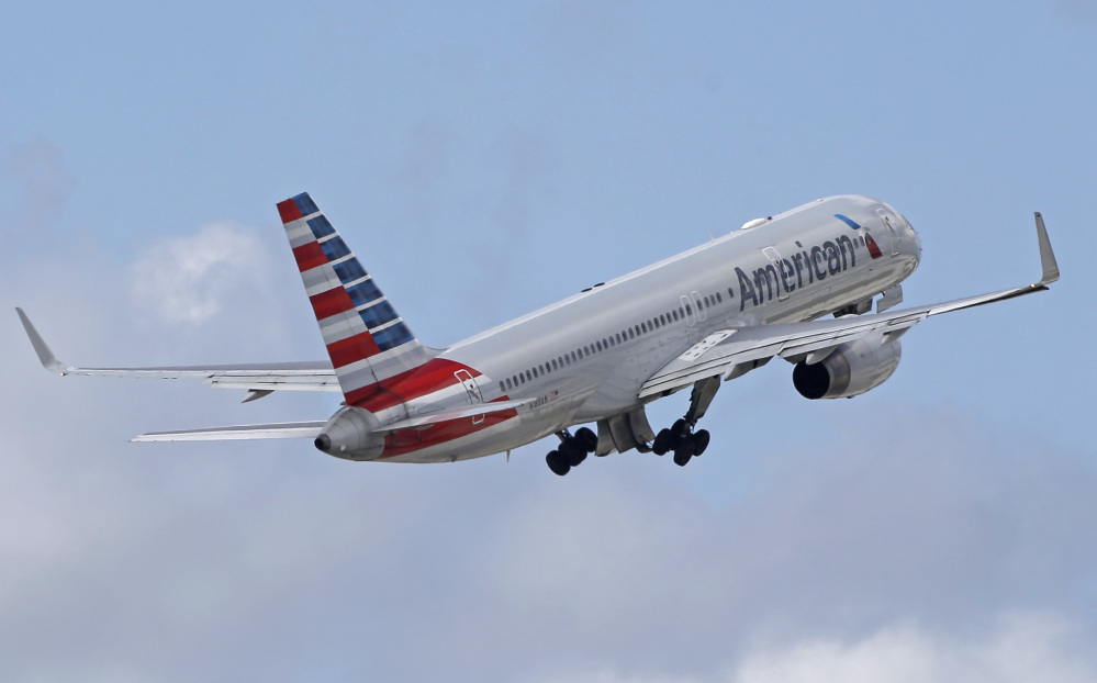 American Airlines chose a light weekend and cut about 200 fights from its schedule before making a flight-operating system change that could have some glitches.