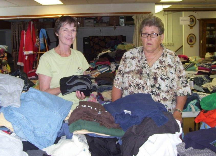 Barbara Rothe and Karin Lyman work to organize gently worn clothing items for the Wayne Community Church Boutique Sale set for 8 a.m. to 1 p.m. Saturday, Sept. 17, and 10:30 a.m.-12:30 p.m. Sunday, Sept. 18.