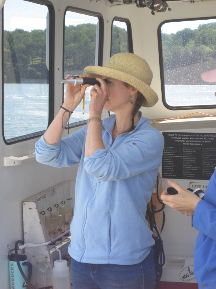 Nicole Danielson, director and science teacher at Maple Tree Community School in Readfield, on the boat during the BLOOM Educators' Program summer workshop she recently attended on exploring oceanography in East Boothbay.