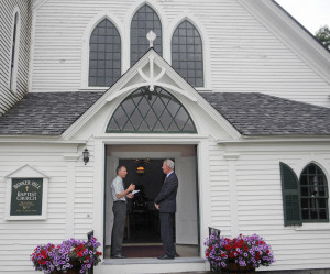 Mark Johnston, right, and Ed "Ted" Lincoln confer Sunday on the steps of the Bunker Hill Baptist Church in Jefferson. Johnston has played instruments for 50 years at the chapel, where Lincoln serves as moderator.