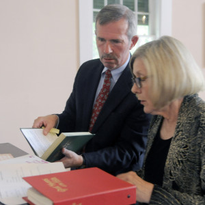 Mark Johnston and Judy Barnes arrange music Sunday before Johnston plays the organ and the piano at the Bunker Hill Baptist Church in Jefferson.