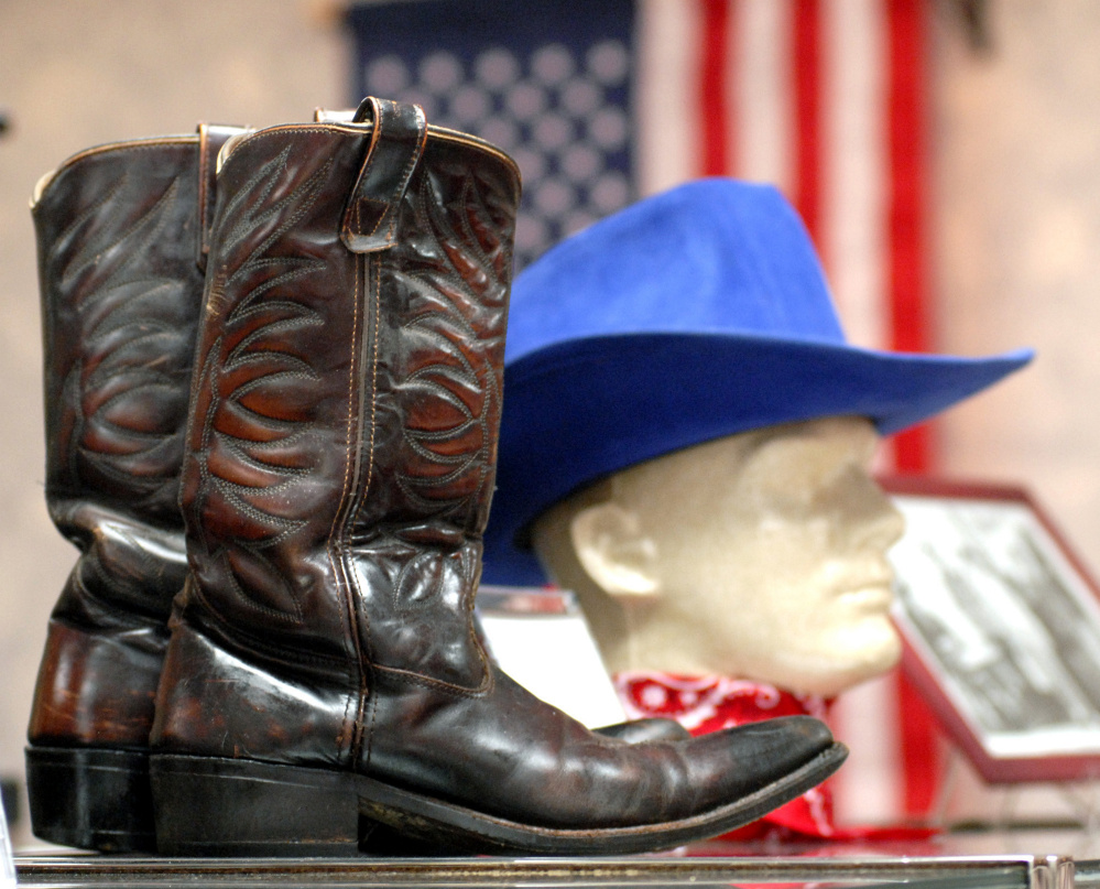 A pair of boots and a hat worn by Bob Elston are seen in 2008 at the Maine Country Music Hall of Fame in Mechanic Falls. Elston, who died in March, was one of the founders of the Maine Country Music Academy in Augusta. The Road Ranger Band, which he founded and which includes his wife, Marlene Carpenter, will perform next week at the Clinton Lions Agricultural Fair.
