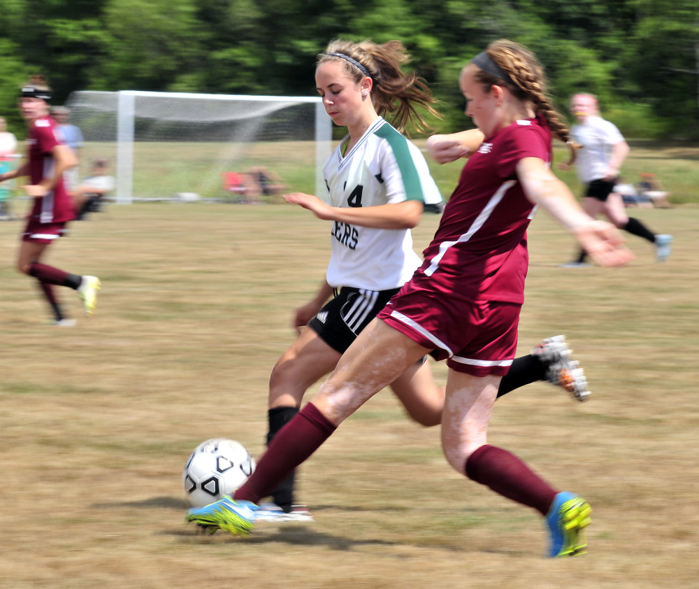 Winthrop's Kenna Souza, left, battles Richmond's Abby Johnson for possession of the ball during a preseason scrimmage Aug. 20 at Richmond High School. Winthrop is coming off a tough season but should contend for a playoff berth in C South this season. Richmond, meanwhile, will look to defend its Class D state crown.