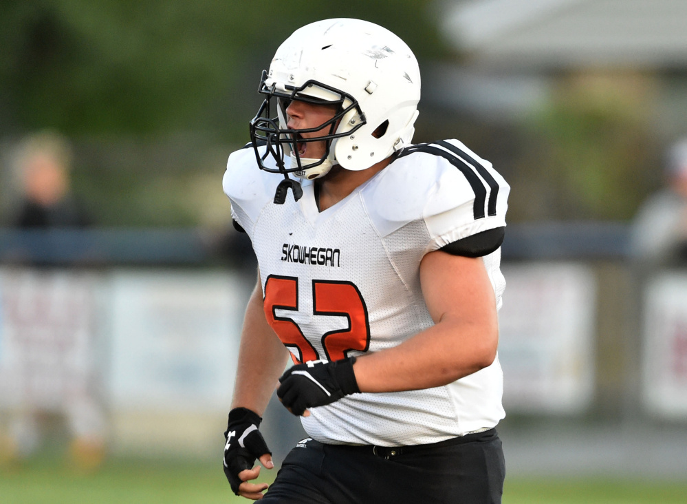 Skowhegan senior tackle Owen Boardman checks out the action during the season opener last Friday against Lawrence.