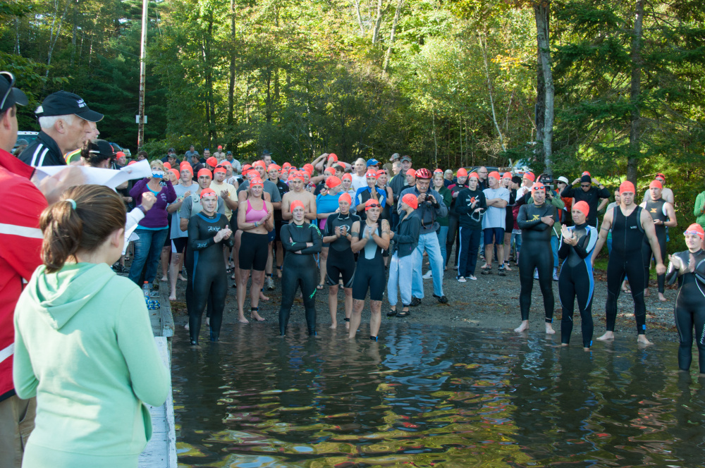 Athletes gather on the east side of Lake George Regional Park for the swimming portion of the 2013 triathlon, an annual fundraiser for the park that will be held Sunday with a ceremony marking the 15th anniversary of the 9/11 terrorist attacks.