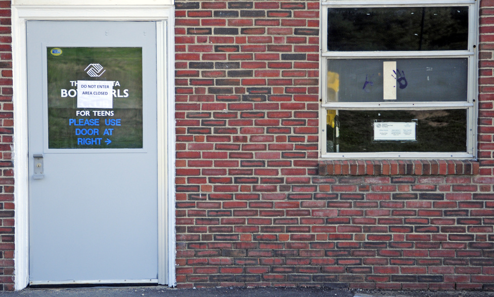 This Wednesday photo shows a sign on the door that indicates part of the building is closed at the Buker Community Center in Augusta.