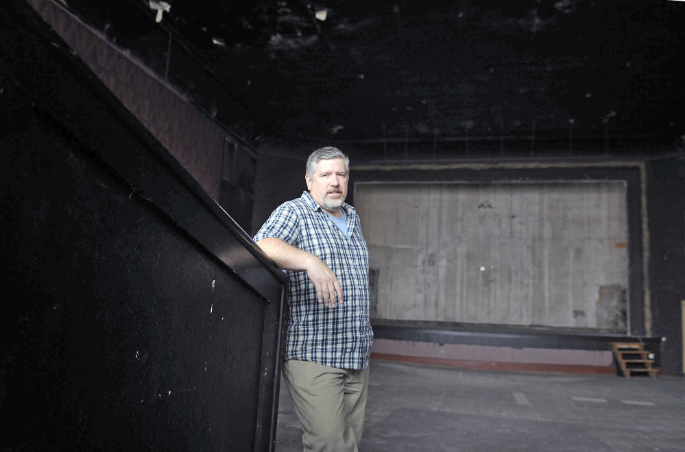Johnson Hall Performing Arts Center Executive Artistic Director Mike Miclon stands in the main theater of Johnson Hall on Thursday, where Kennebec Savings Bank is stepping up to help with the theater's planned opera house renovation by committing itself to acquire tax credits, donate $100,000 and finance the renovation of Johnson Hall, which will cost an estimated $4.3 million.