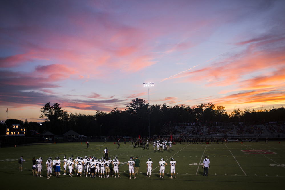A sunset serves as a backdrop to the Bonny Eagle-Scarborough game Friday night. Bonny Eagle won 21-7.