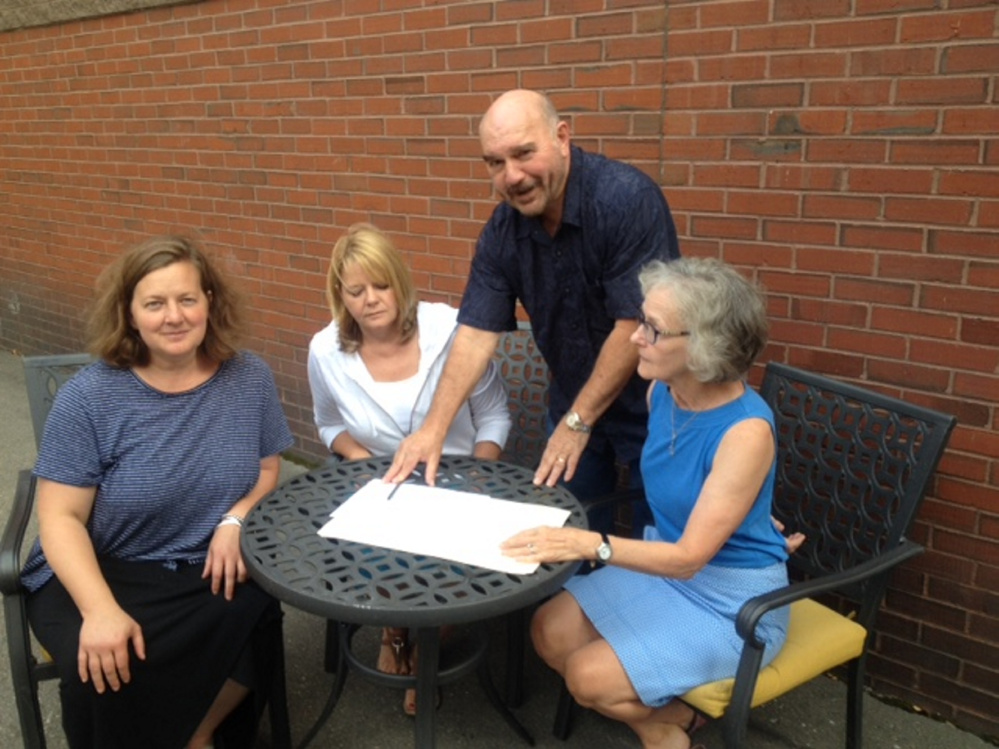 Members of a Skowhegan area business group will travel to Quebec City on Monday for three days of tours of bakeries, breweries and grist mills for possible collaboration. At work planning the tour Thursday were, from left. Amber Lambke, Pam Powers, Jon Kimbell and Jeane Shay.