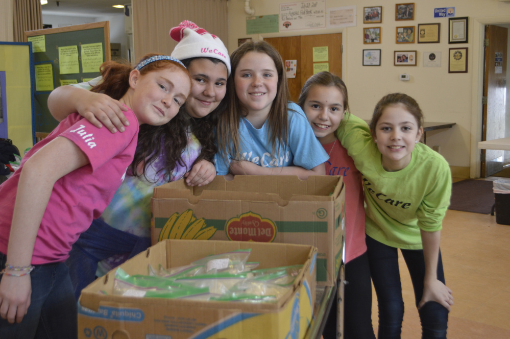 WeCare members recently volunteered at the Augusta Food Bank. From left are Julia Riley, Emma Draper, Shelby Cahill, Katryn Dubois and Maddie Lindquist.