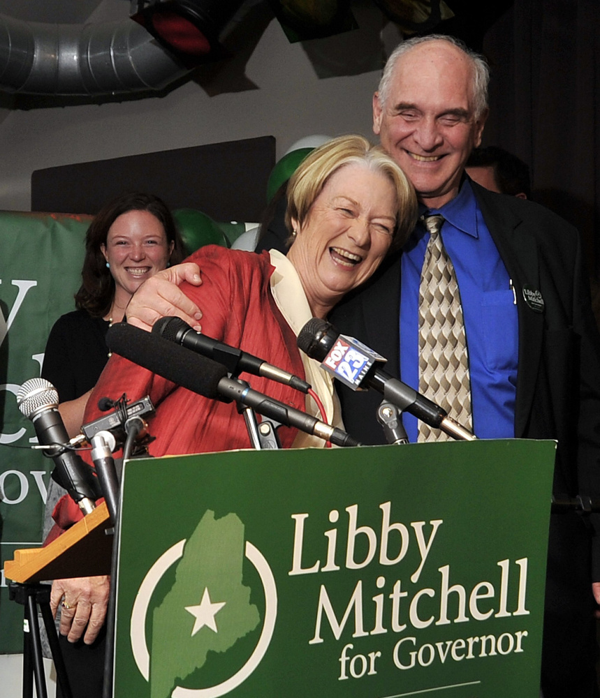 Libby Mitchell gets a hug from her husband, Jim, at her election night gathering on Nov. 2, 2010 at Bayside Bowl in Portland, where Mitchell conceded the governor's race.