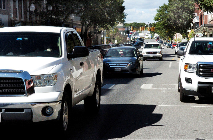 Traffic moves down Main Street in Waterville on Monday. A study that includes a proposal to return the street to two-way traffic has been sent to the state Department of Transportation and will likely go before the public next month.