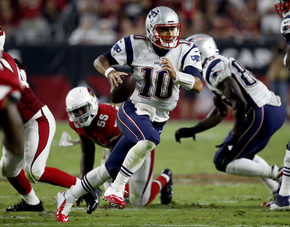 New England Patriots quarterback Jimmy Garoppolo scrambles against the Cardinals during the second half Sunday in Glendale, Arizona.