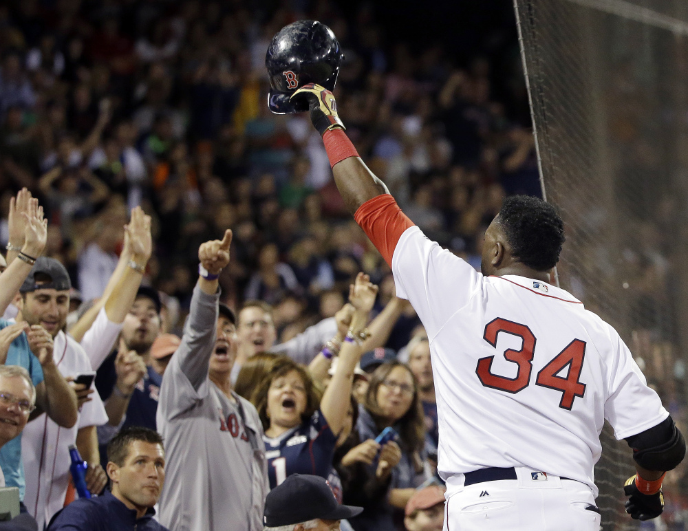 Boston Red Sox designated hitter David Ortiz tips his cap to cheering fans after hitting a solo home run against the Orioles in the sixth inning Monday in Boston.
