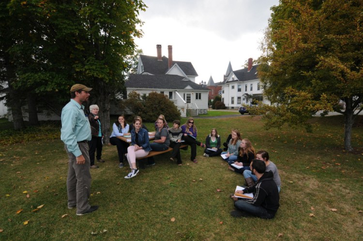 Students of Professor Patti Bailie meet outdoors in this 2015 photo at the University of Maine at Farmington, which has been recognized within its classification of regional colleges in the north as a top public college for 2017 by U.S. News and World Report.