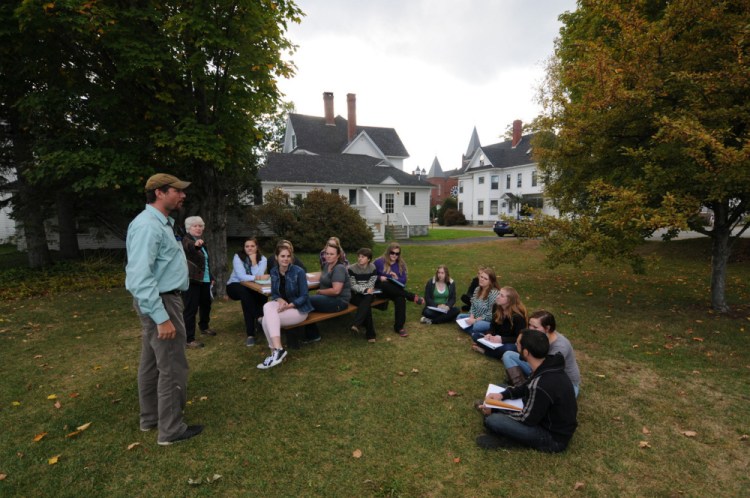 Students of Professor Patti Bailie meet outdoors in this 2015 photo at the University of Maine at Farmington, which has been recognized within its classification of regional colleges in the north as a top public college for 2017 by U.S. News and World Report.