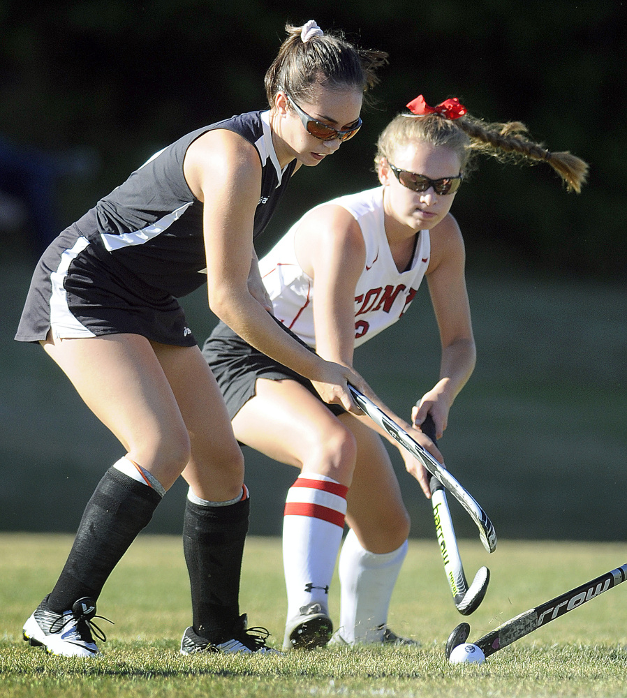 Cony senior Molly Silsby, right, drives past Skowhegan sophomore Maliea Kelso during a Kennebec Valley Athletic Conference Class A game Tuesday in Augusta.