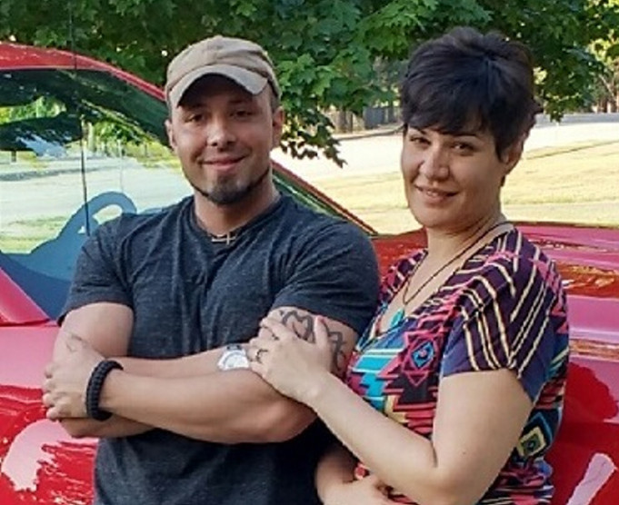 Valerie Tieman, right, is seen with her husband, Luc, in this July photo provided by police. Behind them is the truck she was last seen in Aug. 30 at a Wal-Mart parking lot in Skowhegan.