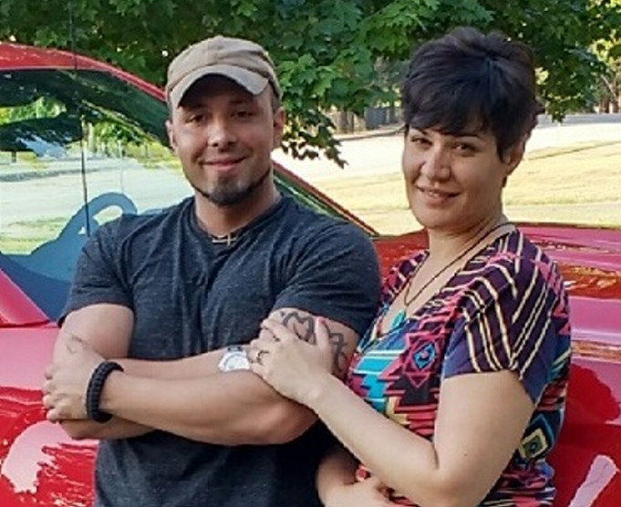 Valerie Tieman, right, is seen with her husband, Luc, in this July photo provided by police. Behind them is the truck she was last seen in Aug. 30 at a Wal-Mart parking lot in Skowhegan.